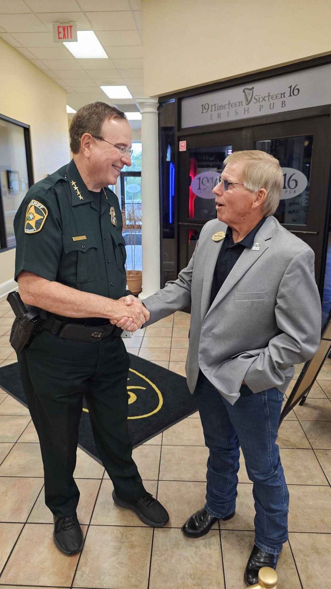Polk County Sheriff Grady Judd shaking hands with Rick Wilson